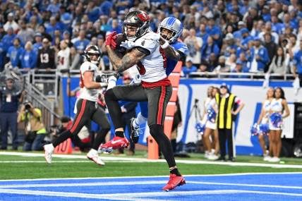 Jan 21, 2024; Detroit, Michigan, USA; Tampa Bay Buccaneers wide receiver Mike Evans (13) makes a catch against Detroit Lions cornerback Cameron Sutton (1) during the second half in a 2024 NFC divisional round game at Ford Field. Mandatory Credit: Lon Horwedel-USA TODAY Sports