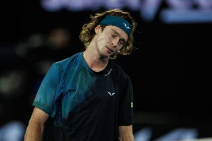 Jan 23, 2024; Melbourne, Victoria, Australia;  
Andrey Rublev of Russia reacts during his match against Jannik Sinner of Italy in the quarter final of the men s singles. Mandatory Credit: Mike Frey-USA TODAY Sports