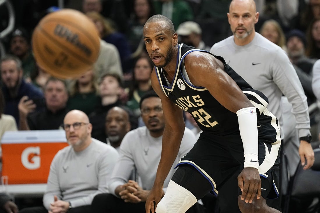 Jan 26, 2024; Milwaukee, Wisconsin, USA;  Milwaukee Bucks forward Khris Middleton (22) looks at the ball during the second quarter against the Cleveland Cavaliers at Fiserv Forum. Mandatory Credit: Jeff Hanisch-USA TODAY Sports