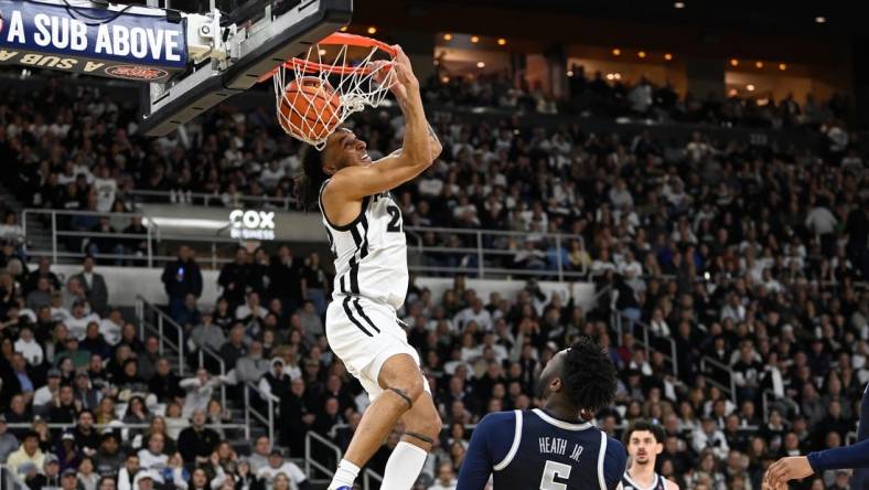 Jan 27, 2024; Providence, Rhode Island, USA; Providence Friars guard Devin Carter (22)  makes a reverse dunk during the first half against the Georgetown Hoyas at Amica Mutual Pavilion. Mandatory Credit: Eric Canha-USA TODAY Sports