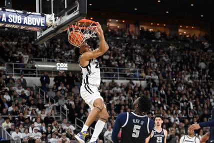 Jan 27, 2024; Providence, Rhode Island, USA; Providence Friars guard Devin Carter (22)  makes a reverse dunk during the first half against the Georgetown Hoyas at Amica Mutual Pavilion. Mandatory Credit: Eric Canha-USA TODAY Sports