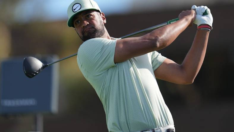 Jan 27, 2024; San Diego, California, USA; Tony Finau hits his tee shot on the fourteenth hole during the final round of the Farmers Insurance Open golf tournament at Torrey Pines Municipal Golf Course - South Course. Mandatory Credit: Ray Acevedo-USA TODAY Sports