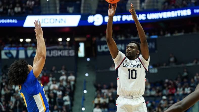 Jan 28, 2024; Hartford, Connecticut, USA; UConn Huskies guard Hassan Diarra (10) shoots for three points against the Xavier Musketeers in the second half at XL Center. Mandatory Credit: David Butler II-USA TODAY Sports