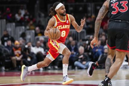 Jan 28, 2024; Atlanta, Georgia, USA; Atlanta Hawks guard Patty Mills (8) brings the ball up the court against the Toronto Raptors during the first half at State Farm Arena. Mandatory Credit: Dale Zanine-USA TODAY Sports