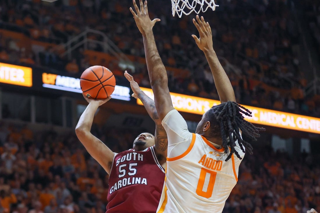 Jan 30, 2024; Knoxville, Tennessee, USA; South Carolina Gamecocks guard Ta'Lon Cooper (55) goes to the basket against Tennessee Volunteers forward Jonas Aidoo (0) during the second half at Thompson-Boling Arena at Food City Center. Mandatory Credit: Randy Sartin-USA TODAY Sports