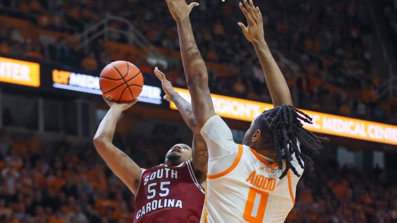 Jan 30, 2024; Knoxville, Tennessee, USA; South Carolina Gamecocks guard Ta'Lon Cooper (55) goes to the basket against Tennessee Volunteers forward Jonas Aidoo (0) during the second half at Thompson-Boling Arena at Food City Center. Mandatory Credit: Randy Sartin-USA TODAY Sports