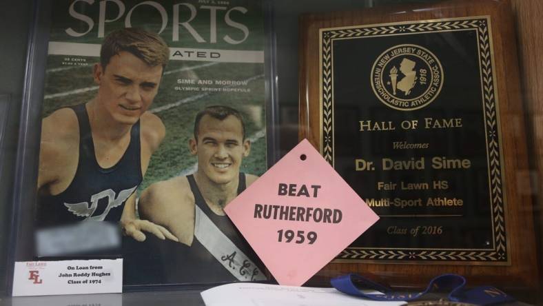 Fair Lawn, NJ -- Feb. 2, 2024 -- A July 1956 cover from Weekly Sports Illustrated features Dave Sime, at left, when he ran track for Duke University.
The trophy case and Hall of Fame Wall at Fair Lawn HS honors one of their alumni, Dave Sime. He was a star athlete at Fair-Lawn in the 1950s, passing away in 2016. He is the grandfather of San Francisco 49ers star running back Christian McCaffrey, who will be playing in the Super Bowl.