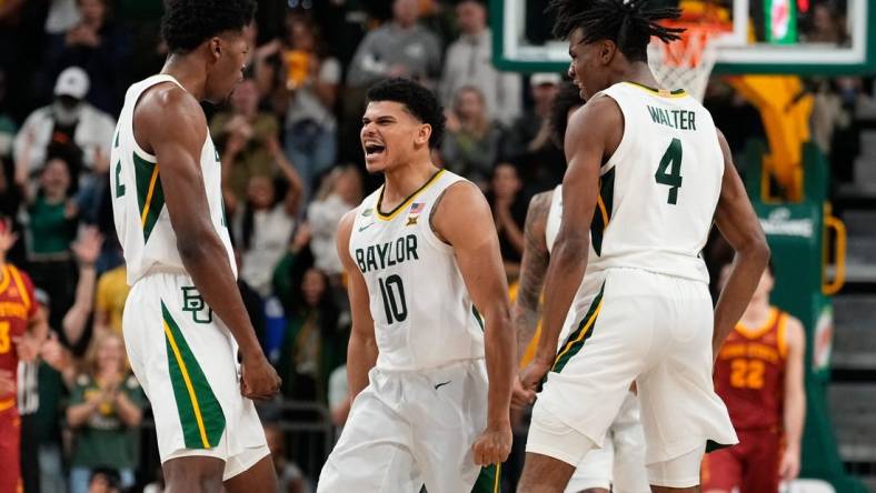 Feb 3, 2024; Waco, Texas, USA; Baylor Bears guard RayJ Dennis (10) celebrates with teammates after scoring a three point basket against the Iowa State Cyclones during the second half at Paul and Alejandra Foster Pavilion. Mandatory Credit: Chris Jones-USA TODAY Sports