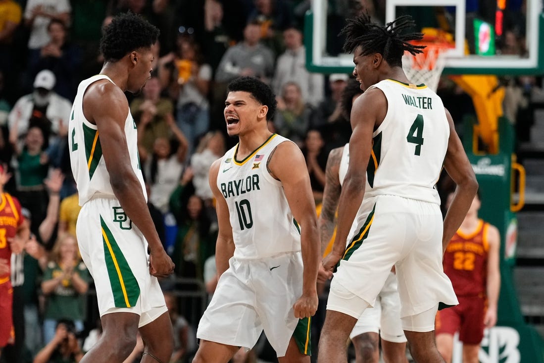 Feb 3, 2024; Waco, Texas, USA; Baylor Bears guard RayJ Dennis (10) celebrates with teammates after scoring a three point basket against the Iowa State Cyclones during the second half at Paul and Alejandra Foster Pavilion. Mandatory Credit: Chris Jones-USA TODAY Sports