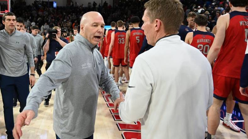 Feb 3, 2024; Spokane, Washington, USA; St. Mary's Gaels head coach Randy Bennett meets with Gonzaga Bulldogs head coach Mark Few after a game at McCarthey Athletic Center. St. Mary's Gaels won 64-62. Mandatory Credit: James Snook-USA TODAY Sports