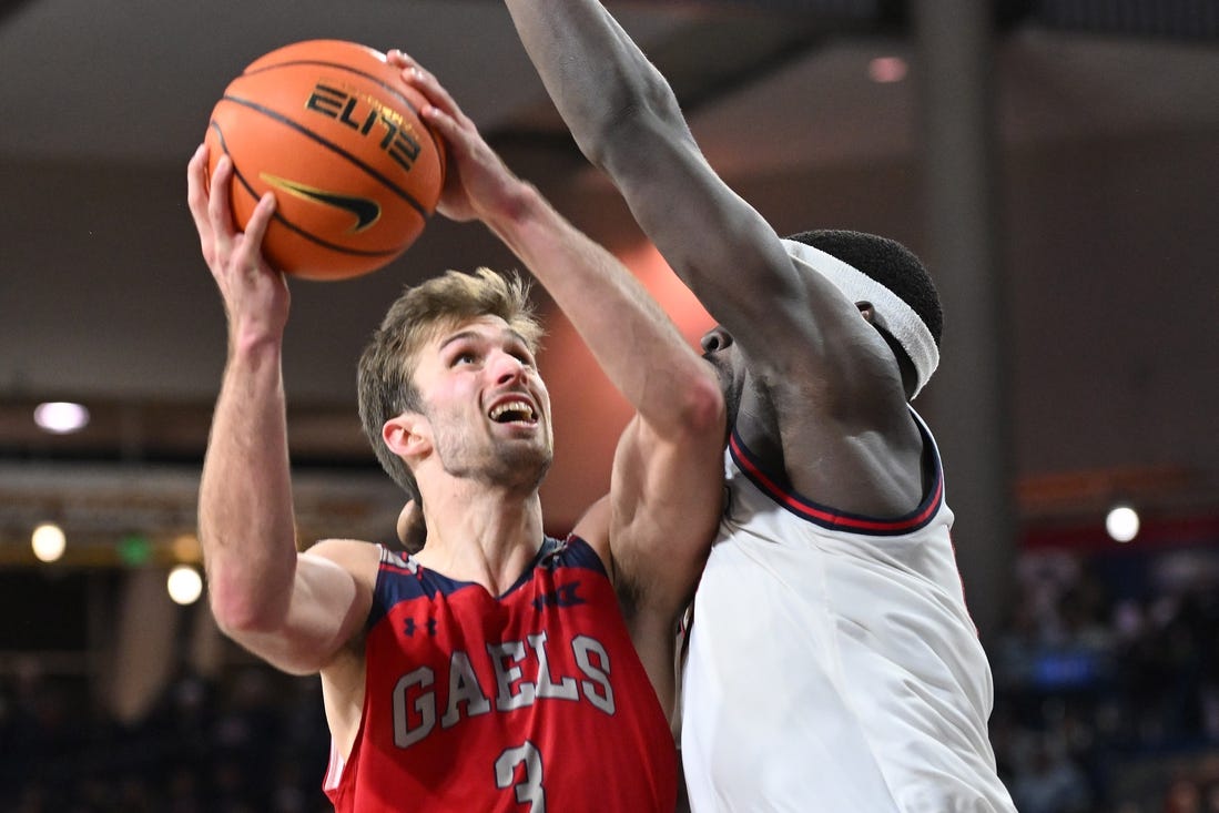 Feb 3, 2024; Spokane, Washington, USA; St. Mary's Gaels guard Augustas Marciulionis (3) shoots the ball against Gonzaga Bulldogs forward Graham Ike (13) in the second half at McCarthey Athletic Center. St. Mary's Gaels won 64-62. Mandatory Credit: James Snook-USA TODAY Sports