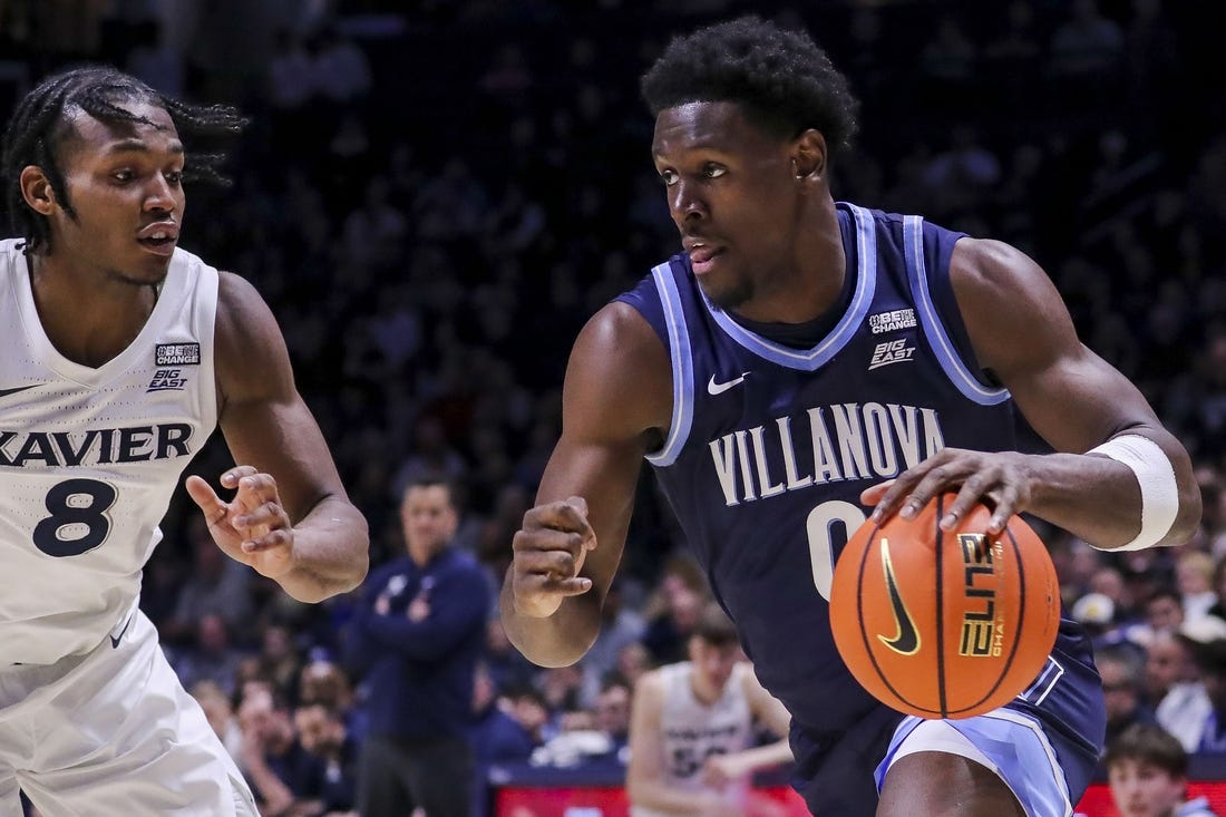 Feb 7, 2024; Cincinnati, Ohio, USA; Villanova Wildcats guard TJ Bamba (0) dribbles against Xavier Musketeers guard Quincy Olivari (8) in the second half at Cintas Center. Mandatory Credit: Katie Stratman-USA TODAY Sports