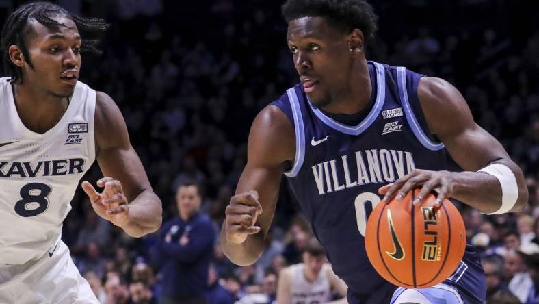 Feb 7, 2024; Cincinnati, Ohio, USA; Villanova Wildcats guard TJ Bamba (0) dribbles against Xavier Musketeers guard Quincy Olivari (8) in the second half at Cintas Center. Mandatory Credit: Katie Stratman-USA TODAY Sports