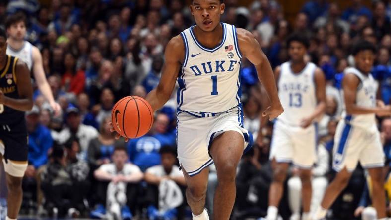 Feb 7, 2024; Durham, North Carolina, USA;  Duke Blue Devils guard Caleb Foster (1) dribbles up court during the second half against the Notre Dame Fighting Irish at Cameron Indoor Stadium. The  Blue Devils won 71-53.Mandatory Credit: Rob Kinnan-USA TODAY Sports