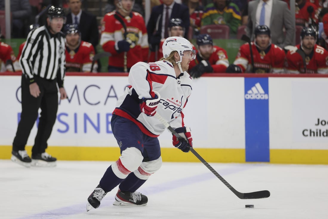 Feb 8, 2024; Sunrise, Florida, USA; Washington Capitals defenseman Rasmus Sandin (38) moves the puck against the Florida Panthers during the first period at Amerant Bank Arena. Mandatory Credit: Sam Navarro-USA TODAY Sports