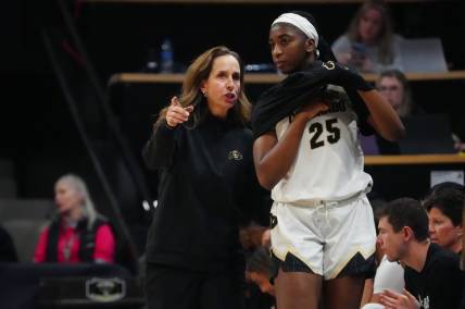 Feb 9, 2024; Boulder, Colorado, USA; Colorado Buffaloes head coach JR Payne talks to forward Brianna McLeod (25) in the second half against the Oregon Ducks at CU Events Center. Mandatory Credit: Ron Chenoy-USA TODAY Sports