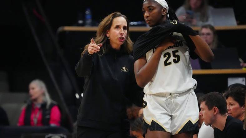 Feb 9, 2024; Boulder, Colorado, USA; Colorado Buffaloes head coach JR Payne talks to forward Brianna McLeod (25) in the second half against the Oregon Ducks at CU Events Center. Mandatory Credit: Ron Chenoy-USA TODAY Sports