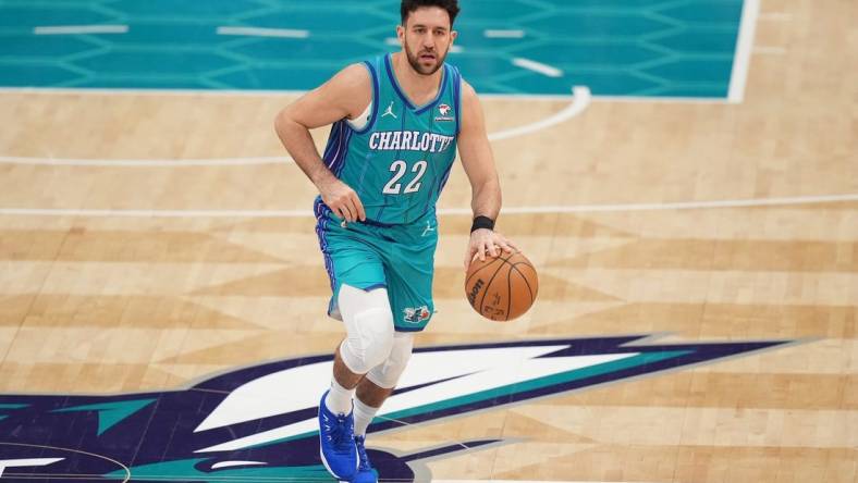 Feb 10, 2024; Charlotte, North Carolina, USA; Charlotte Hornets guard Vasilije Micic (22) brings the ball up court during the second quarter against the Memphis Grizzlies at Spectrum Center. Mandatory Credit: Jim Dedmon-USA TODAY Sports