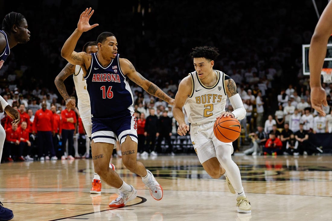 Feb 10, 2024; Boulder, Colorado, USA; Colorado Buffaloes guard KJ Simpson (2) controls the ball against Arizona Wildcats forward Keshad Johnson (16) in the second half at CU Events Center. Mandatory Credit: Isaiah J. Downing-USA TODAY Sports