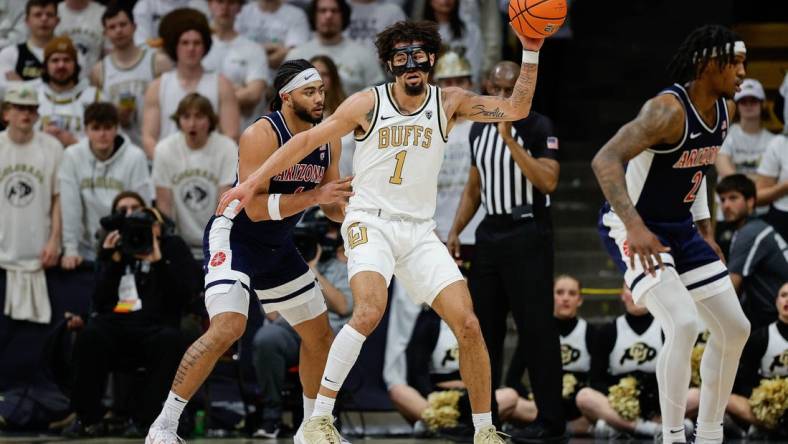 Feb 10, 2024; Boulder, Colorado, USA; Colorado Buffaloes guard J'Vonne Hadley (1) controls the ball against Arizona Wildcats guard Kylan Boswell (4) in the first half at CU Events Center. Mandatory Credit: Isaiah J. Downing-USA TODAY Sports