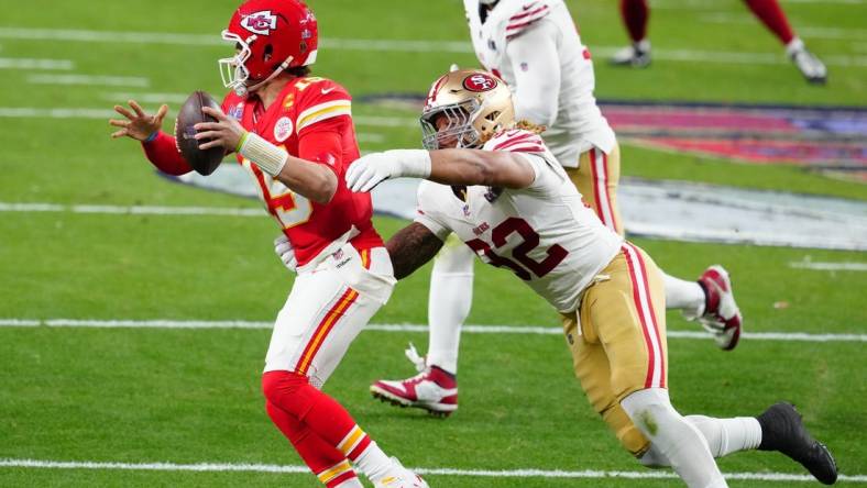 Feb 11, 2024; Paradise, Nevada, USA; Kansas City Chiefs quarterback Patrick Mahomes (15) is pressured by San Francisco 49ers defensive end Chase Young (92) in the first half in Super Bowl LVIII at Allegiant Stadium. Mandatory Credit: Stephen R. Sylvanie-USA TODAY Sports