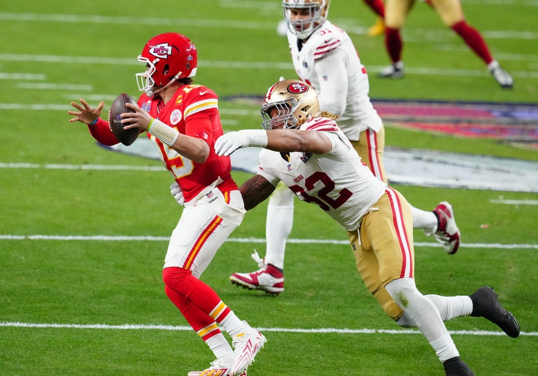 Feb 11, 2024; Paradise, Nevada, USA; Kansas City Chiefs quarterback Patrick Mahomes (15) is pressured by San Francisco 49ers defensive end Chase Young (92) in the first half in Super Bowl LVIII at Allegiant Stadium. Mandatory Credit: Stephen R. Sylvanie-USA TODAY Sports