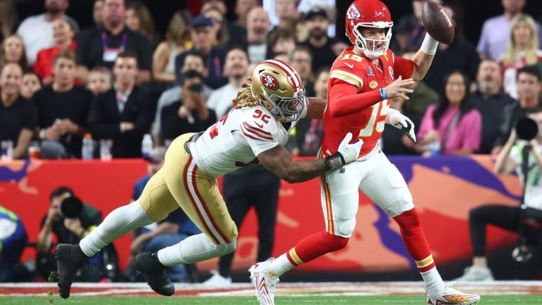 Feb 11, 2024; Paradise, Nevada, USA; Kansas City Chiefs quarterback Patrick Mahomes (15) is pressured by San Francisco 49ers defensive end Chase Young (92) in the first half in Super Bowl LVIII at Allegiant Stadium. Mandatory Credit: Mark J. Rebilas-USA TODAY Sports