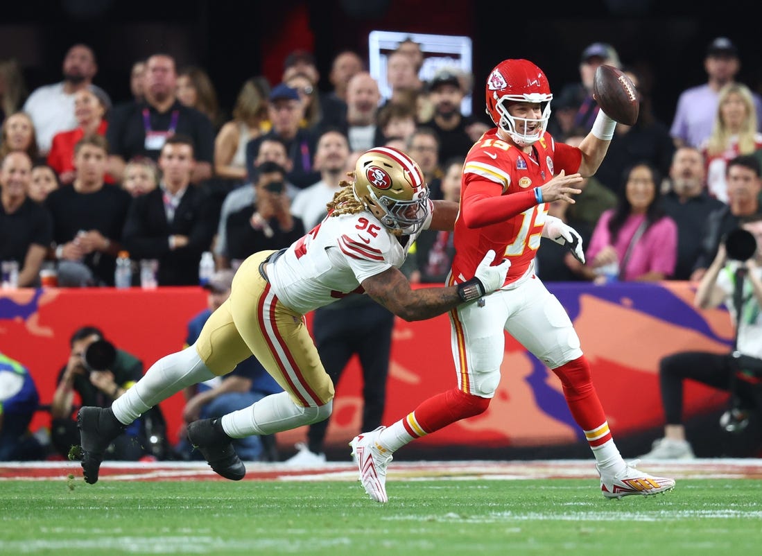 Feb 11, 2024; Paradise, Nevada, USA; Kansas City Chiefs quarterback Patrick Mahomes (15) is pressured by San Francisco 49ers defensive end Chase Young (92) in the first half in Super Bowl LVIII at Allegiant Stadium. Mandatory Credit: Mark J. Rebilas-USA TODAY Sports