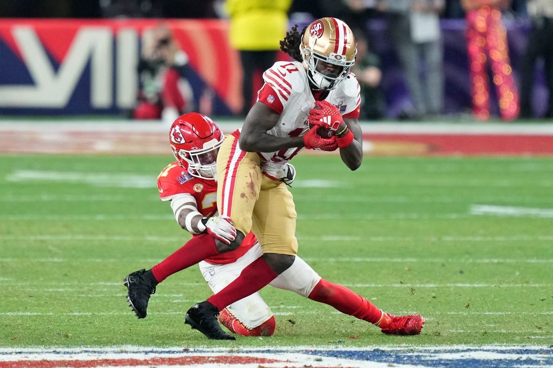 Feb 11, 2024; Paradise, Nevada, USA; Kansas City Chiefs safety Mike Edwards (21) tackles San Francisco 49ers wide receiver Brandon Aiyuk (11) during overtime of Super Bowl LVIII at Allegiant Stadium. Mandatory Credit: Kyle Terada-USA TODAY Sports