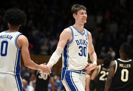 Feb 12, 2024; Durham, North Carolina, USA;  Duke Blue Devils center Kyle Filipowski (30) reacts after beating the Wake Forest Deamon Deacons at Cameron Indoor Stadium. The Blue Devils won 77-69. Mandatory Credit: Rob Kinnan-USA TODAY Sports