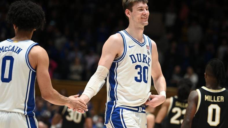 Feb 12, 2024; Durham, North Carolina, USA;  Duke Blue Devils center Kyle Filipowski (30) reacts after beating the Wake Forest Deamon Deacons at Cameron Indoor Stadium. The Blue Devils won 77-69. Mandatory Credit: Rob Kinnan-USA TODAY Sports