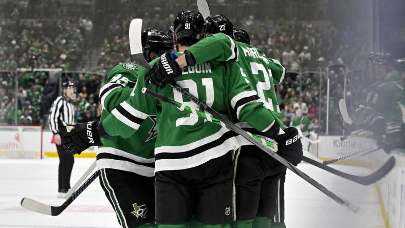 Feb 13, 2024; Dallas, Texas, USA; Dallas Stars center Matt Duchene (95) and center Tyler Seguin (91) and left wing Mason Marchment (27) celebrates a goal scored by Marchment against the Carolina Hurricanes during the second period at the American Airlines Center. Mandatory Credit: Jerome Miron-USA TODAY Sports