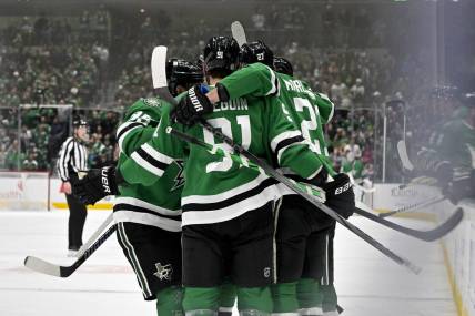 Feb 13, 2024; Dallas, Texas, USA; Dallas Stars center Matt Duchene (95) and center Tyler Seguin (91) and left wing Mason Marchment (27) celebrates a goal scored by Marchment against the Carolina Hurricanes during the second period at the American Airlines Center. Mandatory Credit: Jerome Miron-USA TODAY Sports