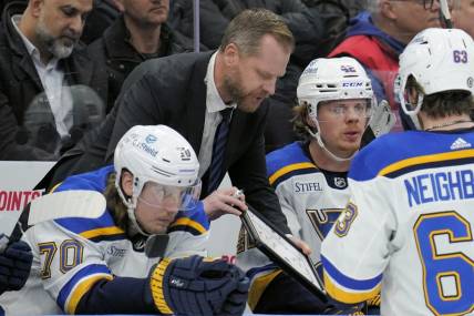 Feb 13, 2024; Toronto, Ontario, CAN; St. Louis Blues head coach Drew Bannister explains a play to his players during a break in the action against the Toronto Maple Leafs during the third period Scotiabank Arena. Mandatory Credit: John E. Sokolowski-USA TODAY Sports