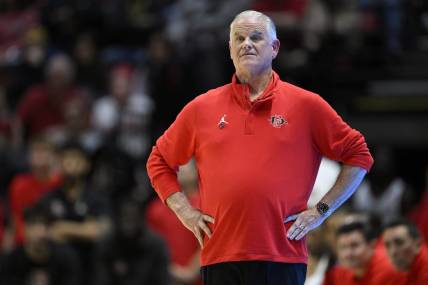 Feb 13, 2024; San Diego, California, USA; San Diego State Aztecs head coach Brian Dutcher looks on during the first half against the Colorado State Rams at Viejas Arena. Mandatory Credit: Orlando Ramirez-USA TODAY Sports