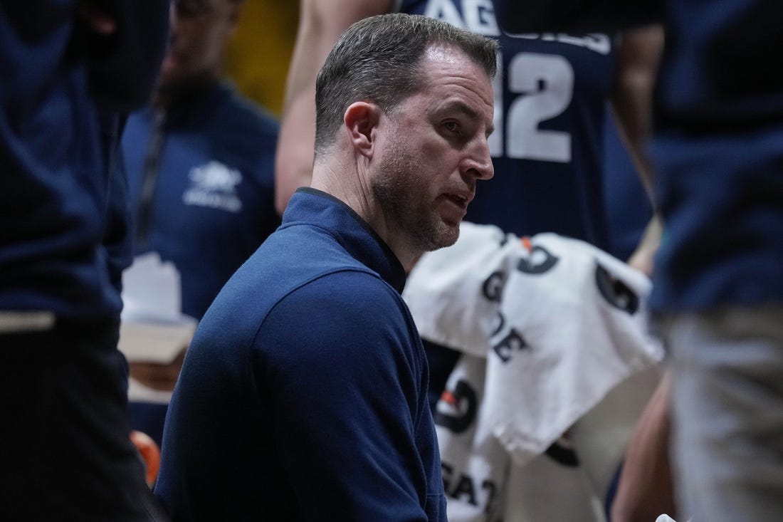 Feb 14, 2024; Laramie, Wyoming, USA; Utah State Aggies head coach Danny Sprinkle draws up a play against the Wyoming Cowboys during the second half at Arena-Auditorium. Mandatory Credit: Troy Babbitt-USA TODAY Sports