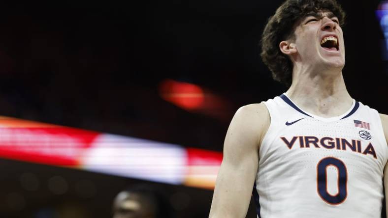 Feb 17, 2024; Charlottesville, Virginia, USA; Virginia Cavaliers forward Blake Buchanan (0) reacts after scoring while being fouled against the Wake Forest Demon Deacons in the second half at John Paul Jones Arena. Mandatory Credit: Geoff Burke-USA TODAY Sports