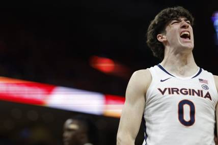 Feb 17, 2024; Charlottesville, Virginia, USA; Virginia Cavaliers forward Blake Buchanan (0) reacts after scoring while being fouled against the Wake Forest Demon Deacons in the second half at John Paul Jones Arena. Mandatory Credit: Geoff Burke-USA TODAY Sports