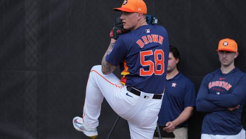 Feb 17, 2024; West Palm Beach, FL, USA; Houston Astros starting pitcher Hunter Brown (58) works in the bullpen during workouts at spring training. Mandatory Credit: Jim Rassol-USA TODAY Sports