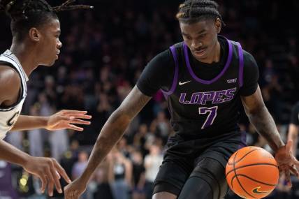 GCU guard Tyon Grant-Foster (7) dribbles the ball upcourt at Grand Canyon University Arena in Phoenix on Feb. 17, 2024.