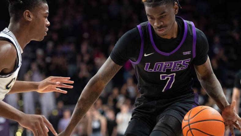 GCU guard Tyon Grant-Foster (7) dribbles the ball upcourt at Grand Canyon University Arena in Phoenix on Feb. 17, 2024.