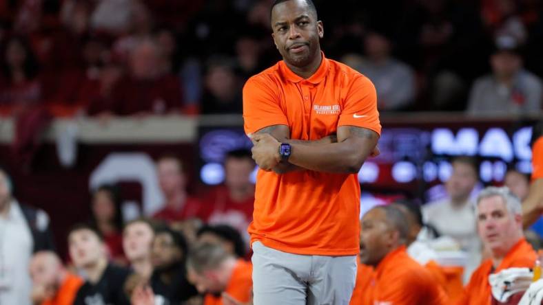 Oklahoma State coach Mike Boynton watches his team during a Bedlam college basketball game between the University of Oklahoma Sooners (OU) and the Oklahoma State Cowboys (OSU) at Lloyd Noble Center in Norman, Okla., Saturday, Feb. 10, 2024. Oklahoma won 66-62.