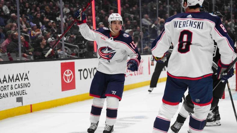 Feb 20, 2024; Los Angeles, California, USA; Columbus Blue Jackets left wing Johnny Gaudreau (13) celebrates with defenseman Zach Werenski (8) against the LA Kings in the first period at Crypto.com Arena. Mandatory Credit: Kirby Lee-USA TODAY Sports