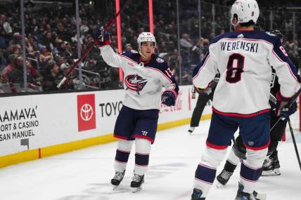 Feb 20, 2024; Los Angeles, California, USA; Columbus Blue Jackets left wing Johnny Gaudreau (13) celebrates with defenseman Zach Werenski (8) against the LA Kings in the first period at Crypto.com Arena. Mandatory Credit: Kirby Lee-USA TODAY Sports