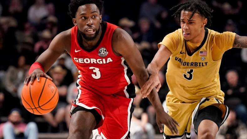 Georgia guard Noah Thomasson (3) is guarded by Vanderbilt guard Paul Lewis (3) during the second half at Memorial Gym in Nashville, Tenn., Wednesday, Feb. 21, 2024.