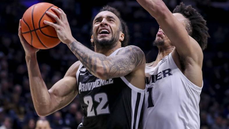 Feb 21, 2024; Cincinnati, Ohio, USA; Providence Friars guard Devin Carter (22) drives to the basket against Xavier Musketeers guard Desmond Claude (1) in the second half at Cintas Center. Mandatory Credit: Katie Stratman-USA TODAY Sports