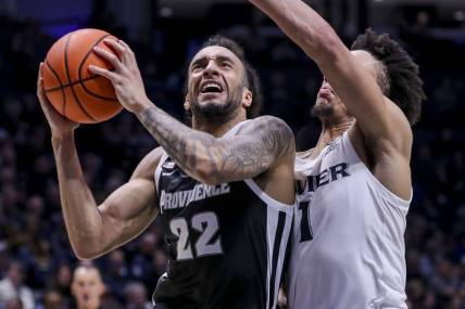 Feb 21, 2024; Cincinnati, Ohio, USA; Providence Friars guard Devin Carter (22) drives to the basket against Xavier Musketeers guard Desmond Claude (1) in the second half at Cintas Center. Mandatory Credit: Katie Stratman-USA TODAY Sports