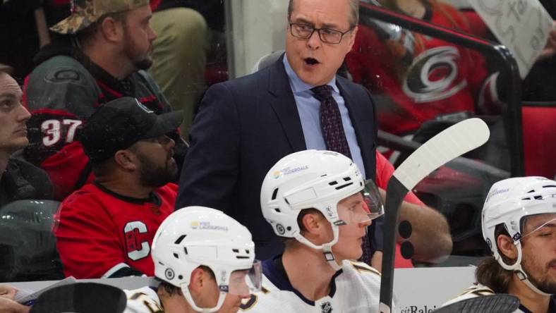 Feb 22, 2024; Raleigh, North Carolina, USA; Florida Panthers head coach Paul Maurice reacts from behind the bench during the second period against the Carolina Hurricanes at PNC Arena. Mandatory Credit: James Guillory-USA TODAY Sports