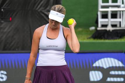 American Tennis Player Danielle Collins holds up a ball after scoring during her ATX Open Round 16 match against Caty McNally at the Westwood Country Club on Thursday, March. 2, 2023 in Austin.