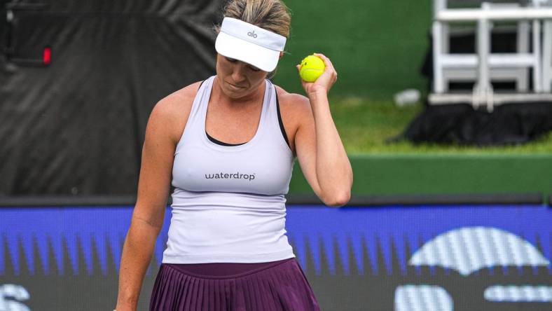 American Tennis Player Danielle Collins holds up a ball after scoring during her ATX Open Round 16 match against Caty McNally at the Westwood Country Club on Thursday, March. 2, 2023 in Austin.